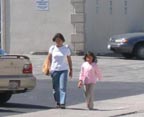Parent and child walking on Karen Road to San Mateo Gymnastics