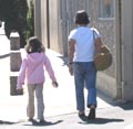 Parent and child walking to San Mateo Gymnastics on Elmer Street, Belmont, CA